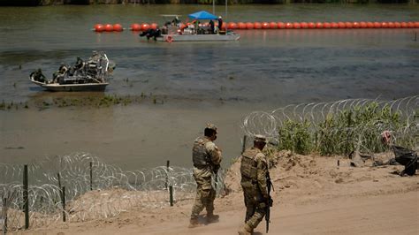 Justice Department tells Texas that floating barrier on Rio Grande raises humanitarian concerns